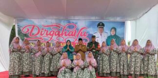 Wujud Syukur dan Kebersamaan, Babinsa Koramil 08/Bangun Hadiri Tasyakuran HUT Ke-21 Nagori Gajing Jaya